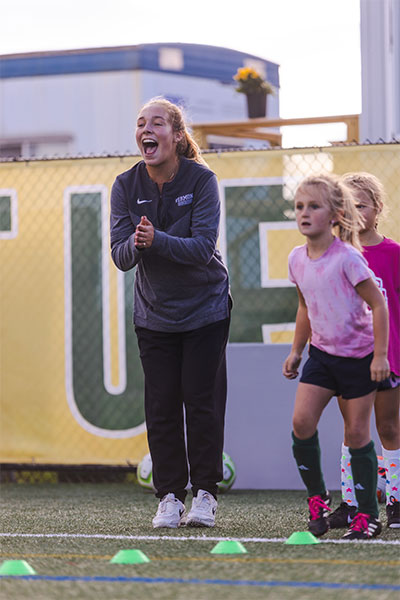Coach instructing players